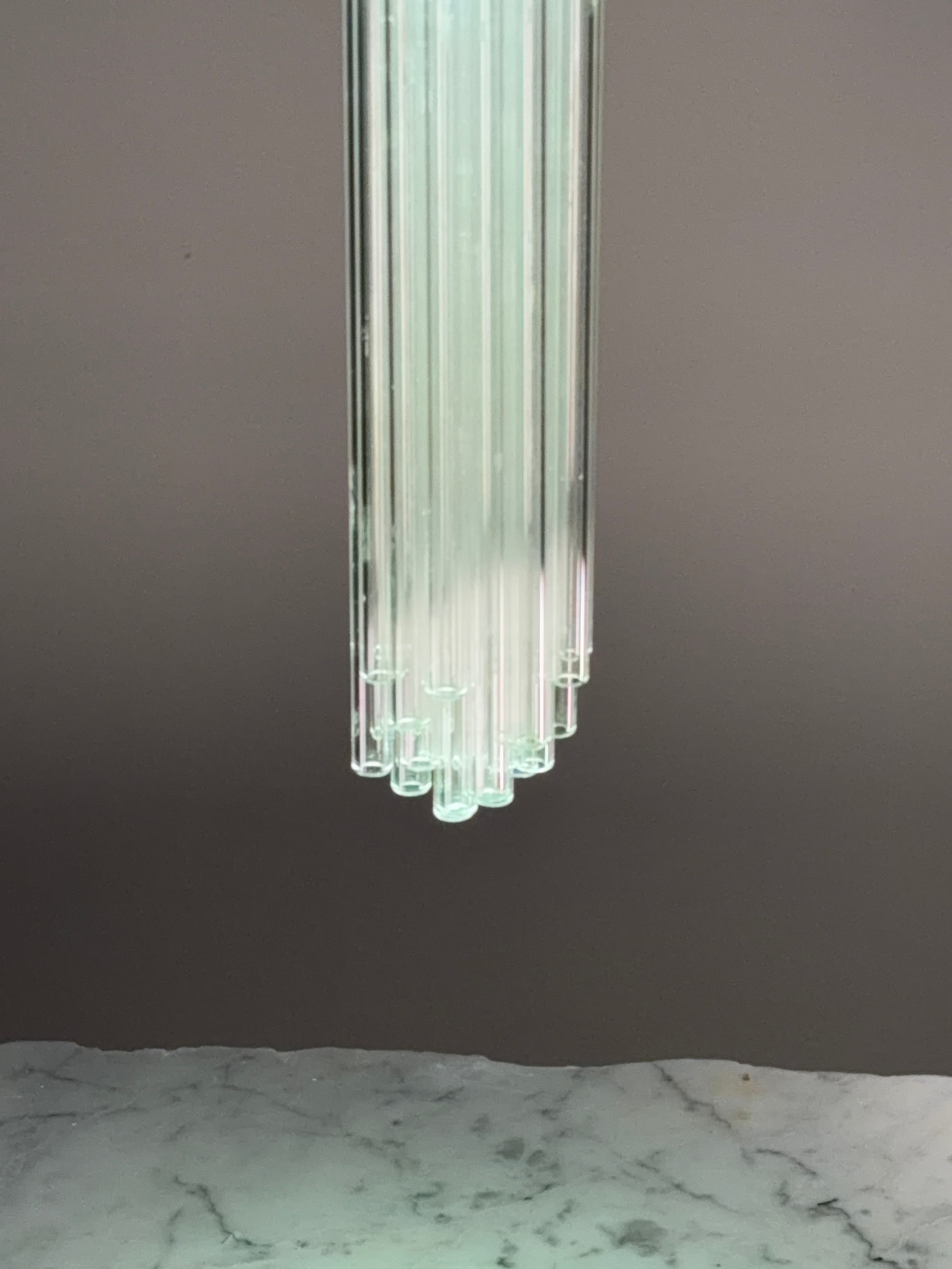 Illuminated glass straw detail above marble