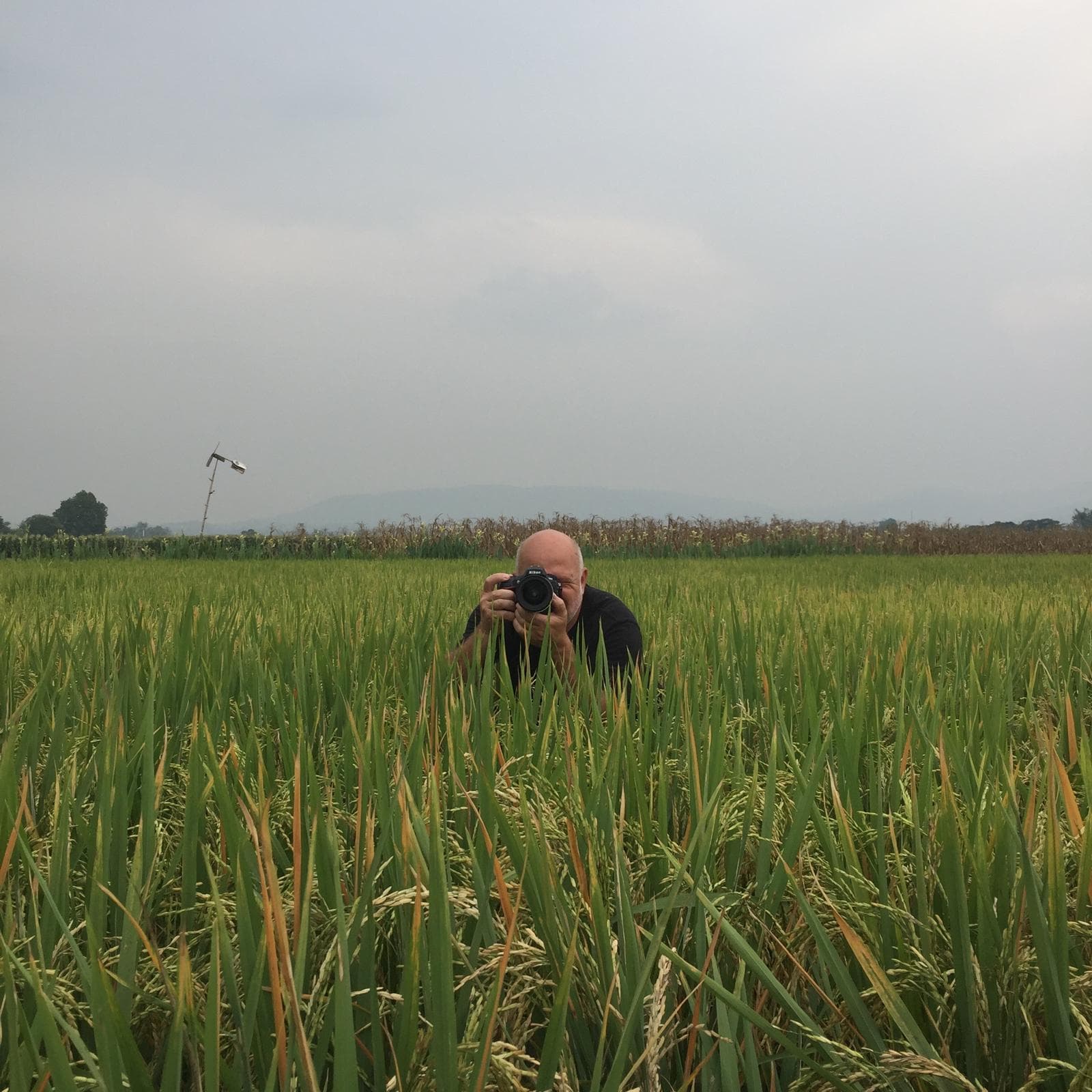 Mark Lever photographing outdoors