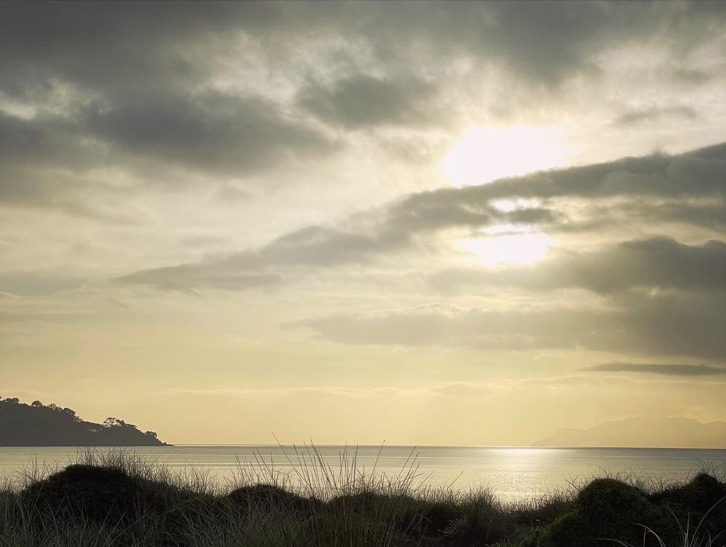 Golden light across the coast and distant headland